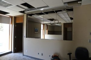Hole Cut Into Wall in Former Office